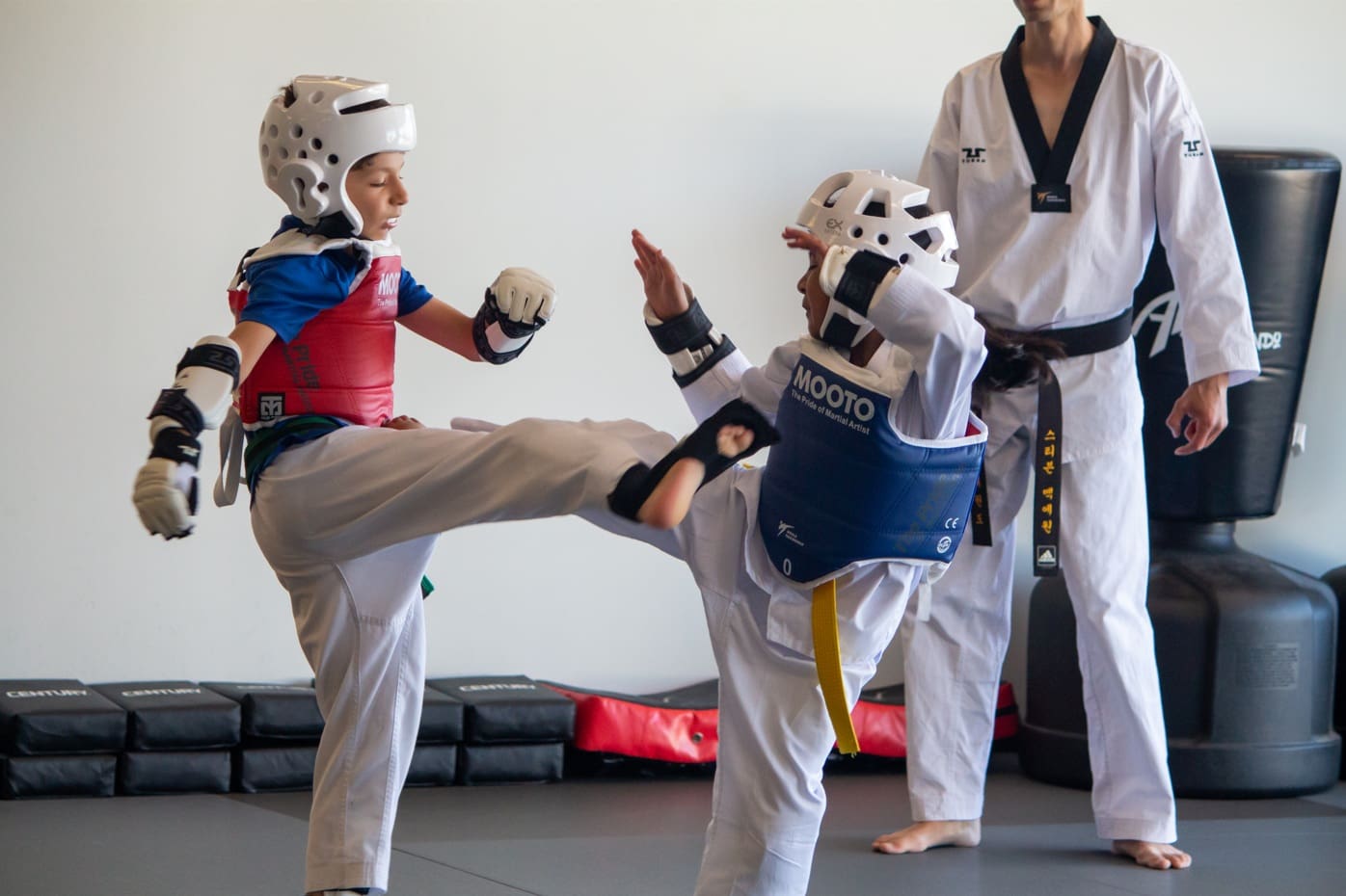 Martial arts practice is not only a team sport but also supports spiritual development, goal setting, and respect, helping kids stay focused at their own pace while developing fluid movements, self-defense skills, and other lifelong habits.