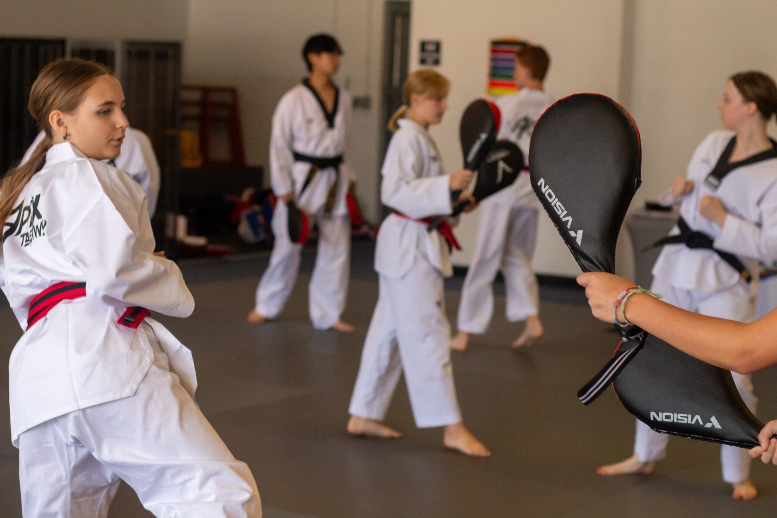 Through engaging martial arts classes, students of all levels learn grappling, fluid movements, and complex moves at their own pace, supported by experienced instructors who help kids build self-esteem, motor skills, and a self-confident mindset.