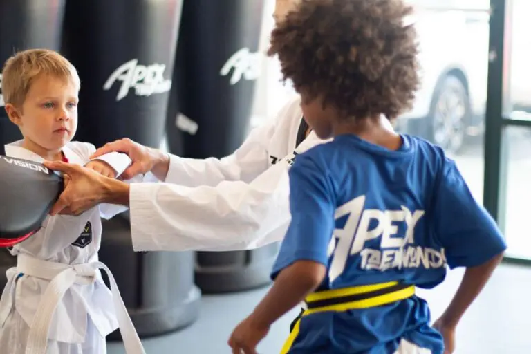 children learning kids martial arts in a class setting