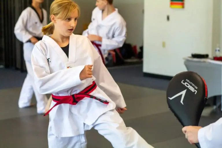 beginner taekwondo student practicing kicks