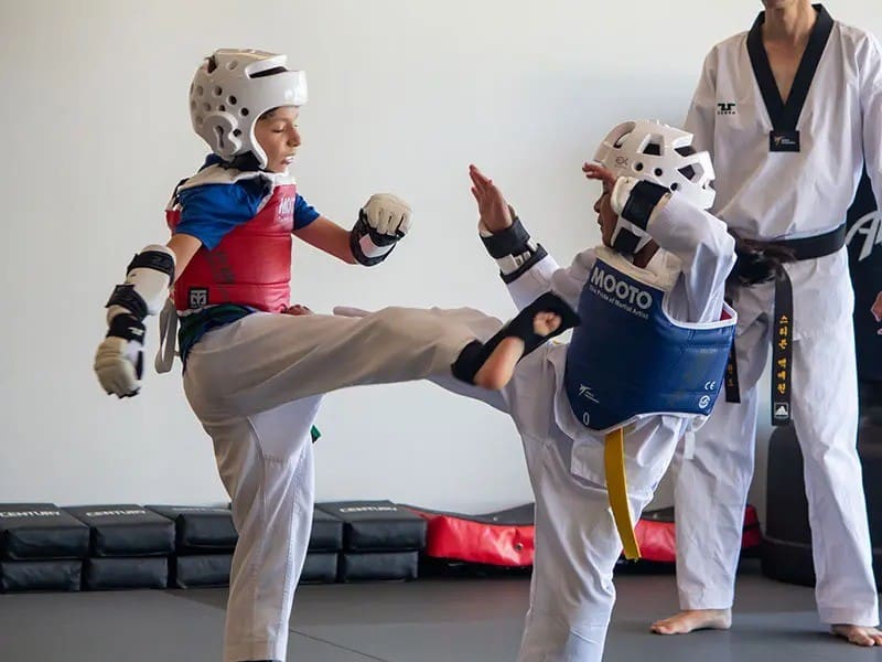 students sparring for kids taekwondo classes