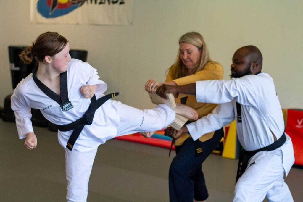 teen doing kicks for teens taekwondo class